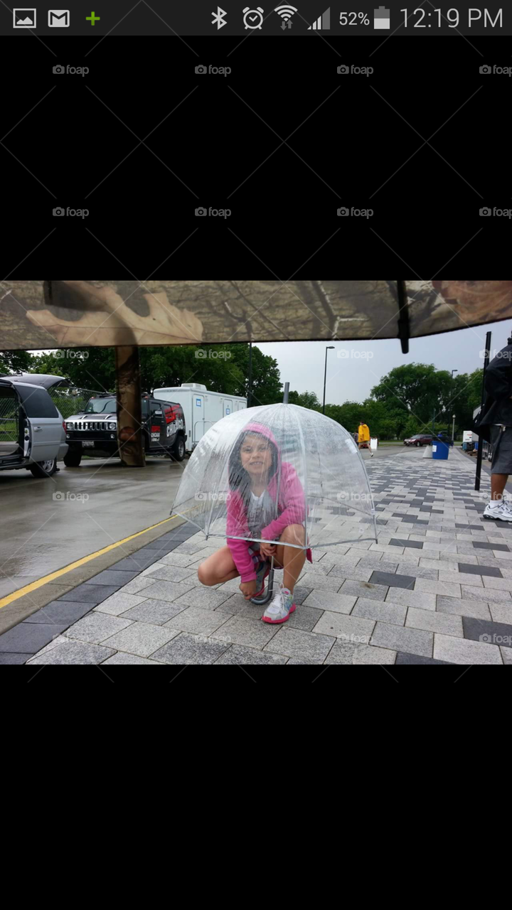 Retro Umbrella. Child under a transparent retro dome umbrella