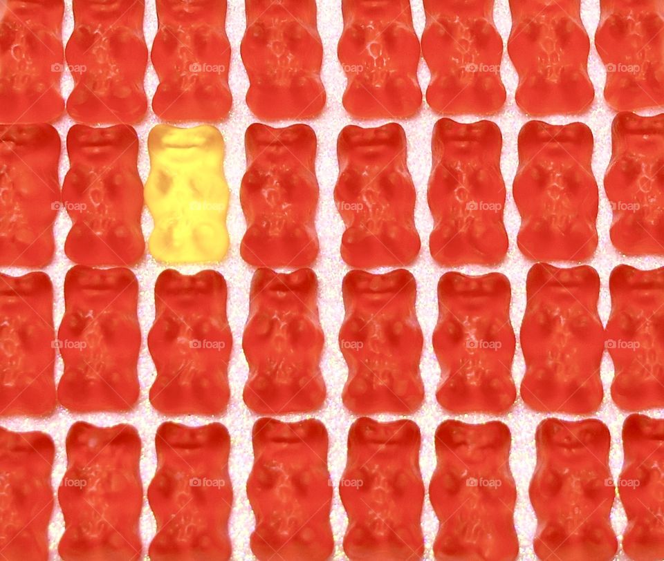 Red Gummy bears with a yellow gummy bear