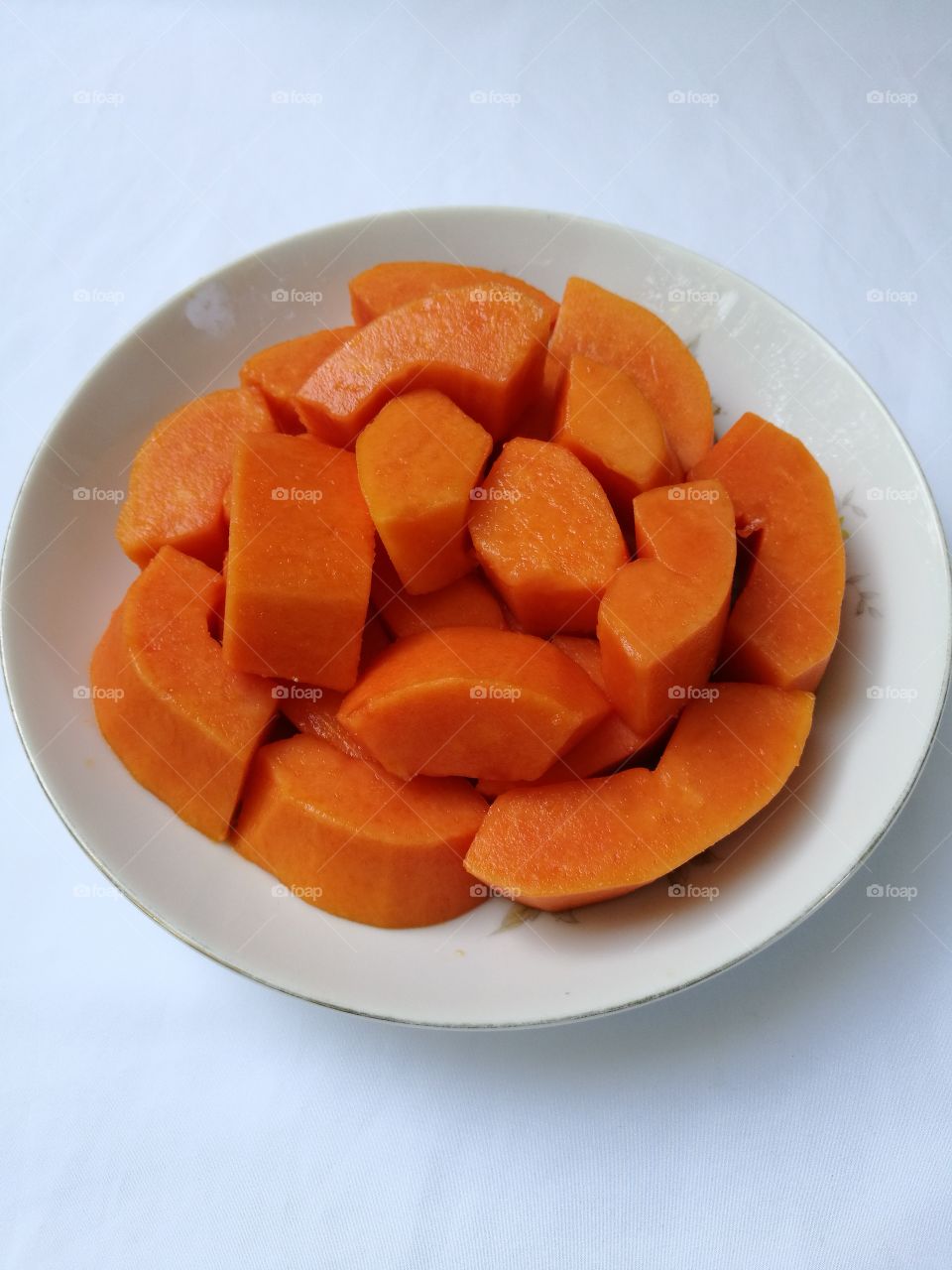 sliced papaya in a plate