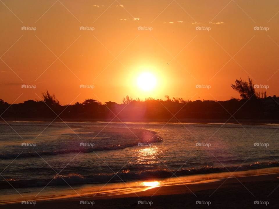 Beach sunset. Sunset on Do Canto Beach, Buzio, Rio de Janeiro, Brazil