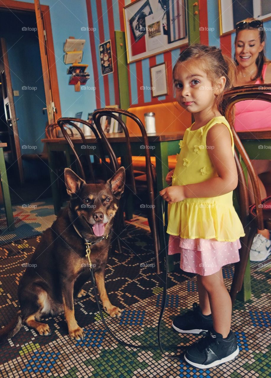 A girl and her dog. Captured at a Café in Stockholm, Sweden