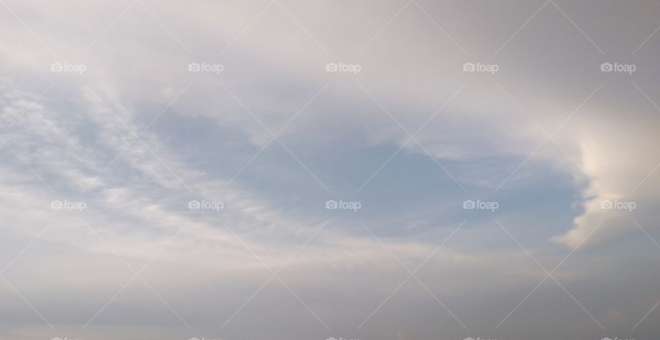 Moon cloud hanging in the sky .