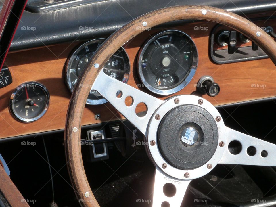 the vintage and elegant steering wheel of an old car