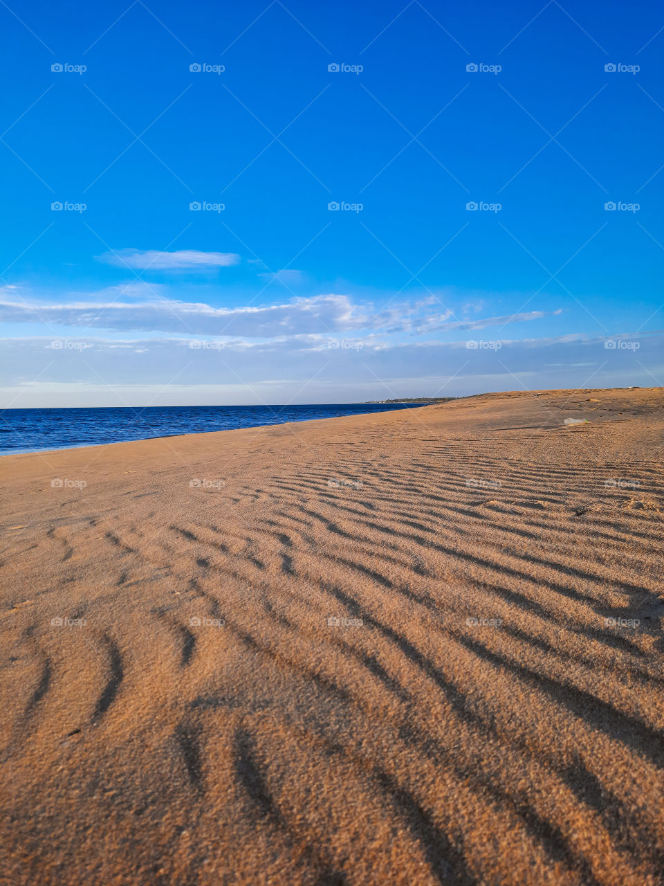 Perfect summer evening on a gorgeous sandy beach and perfect blue waters. Secret hidden beaches with perfect views of Indian Ocean.