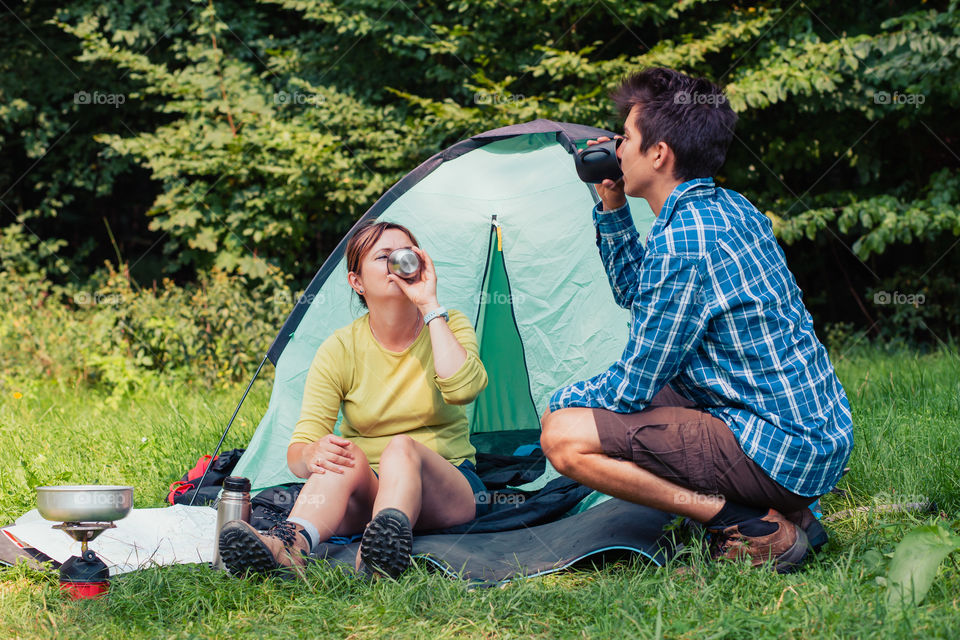 Spending a vacation on camping. Preparing a meal outdoor. Planning next trip