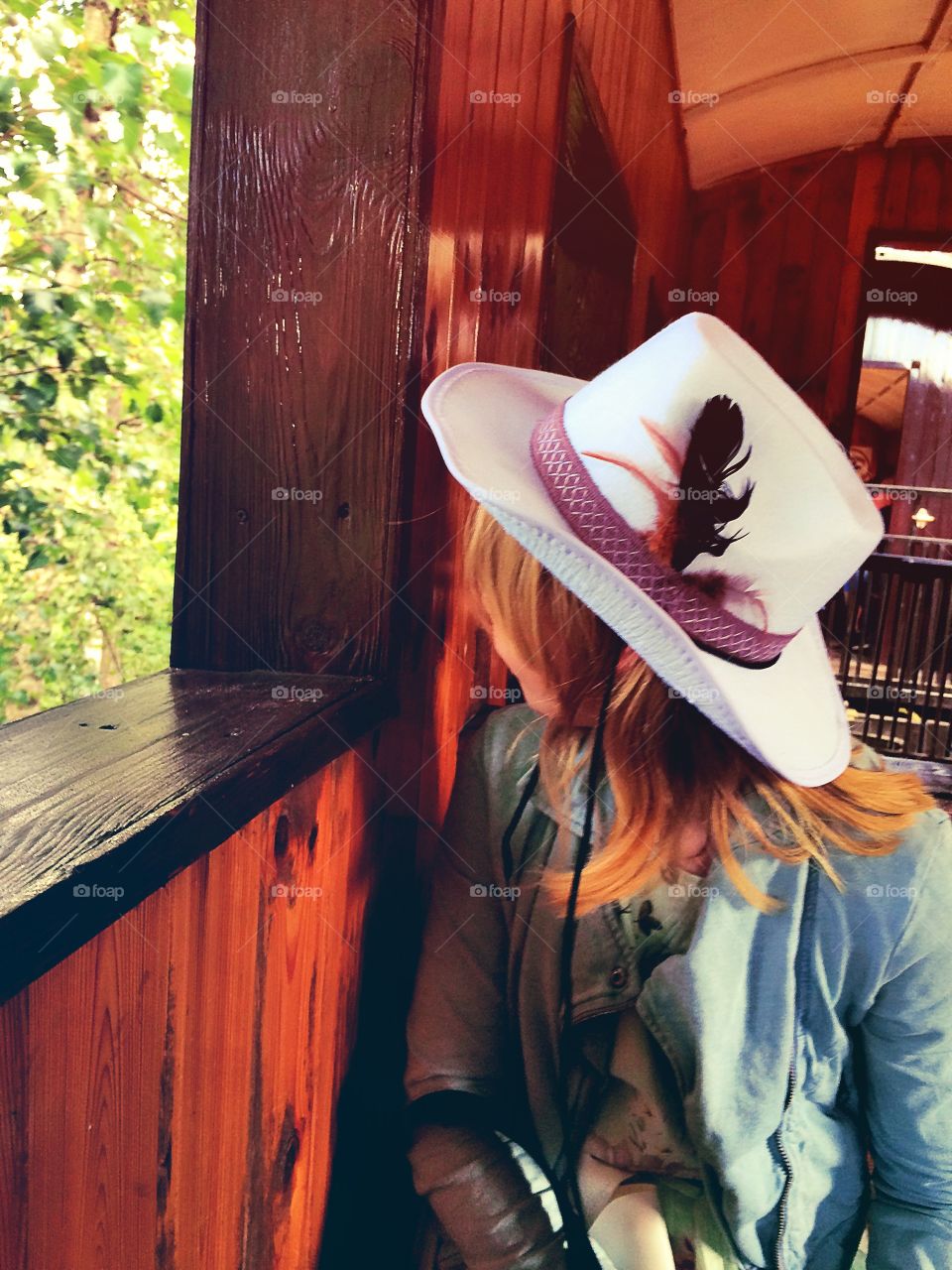 Cowgirl. Cowgirl in an old train