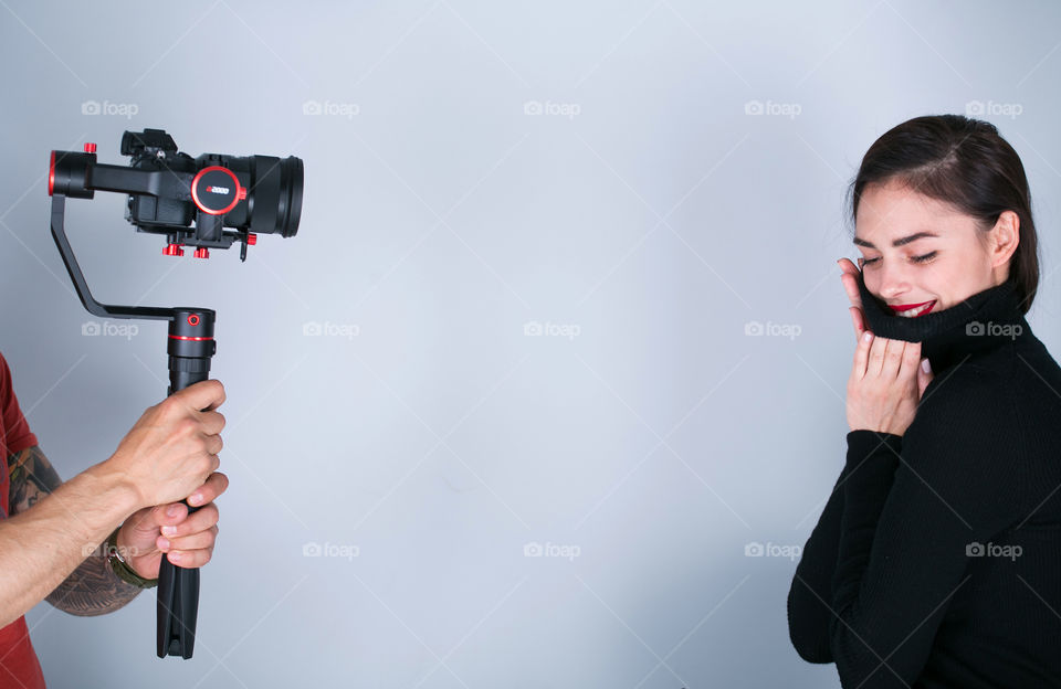 Beautiful women posing on camera at the studio 