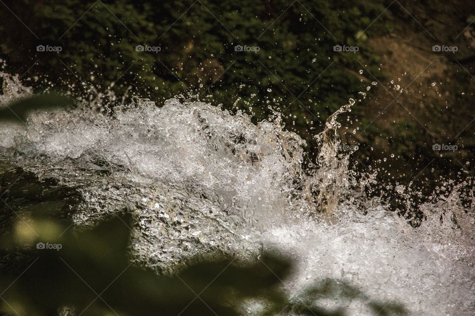 Flowing water a top a waterfall