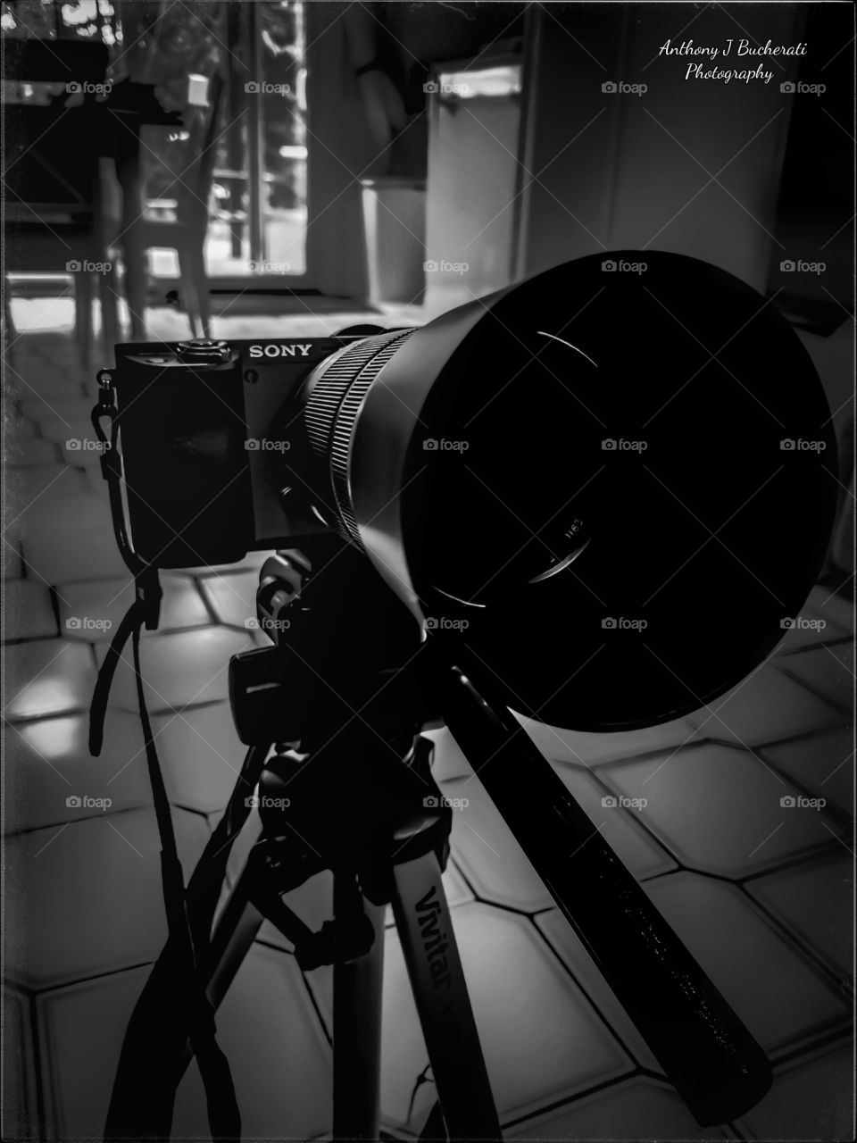 Sony a6000 in graphite with A 55-210 Sony Zoom lens in silver. sleek and Stylish with all the curves.