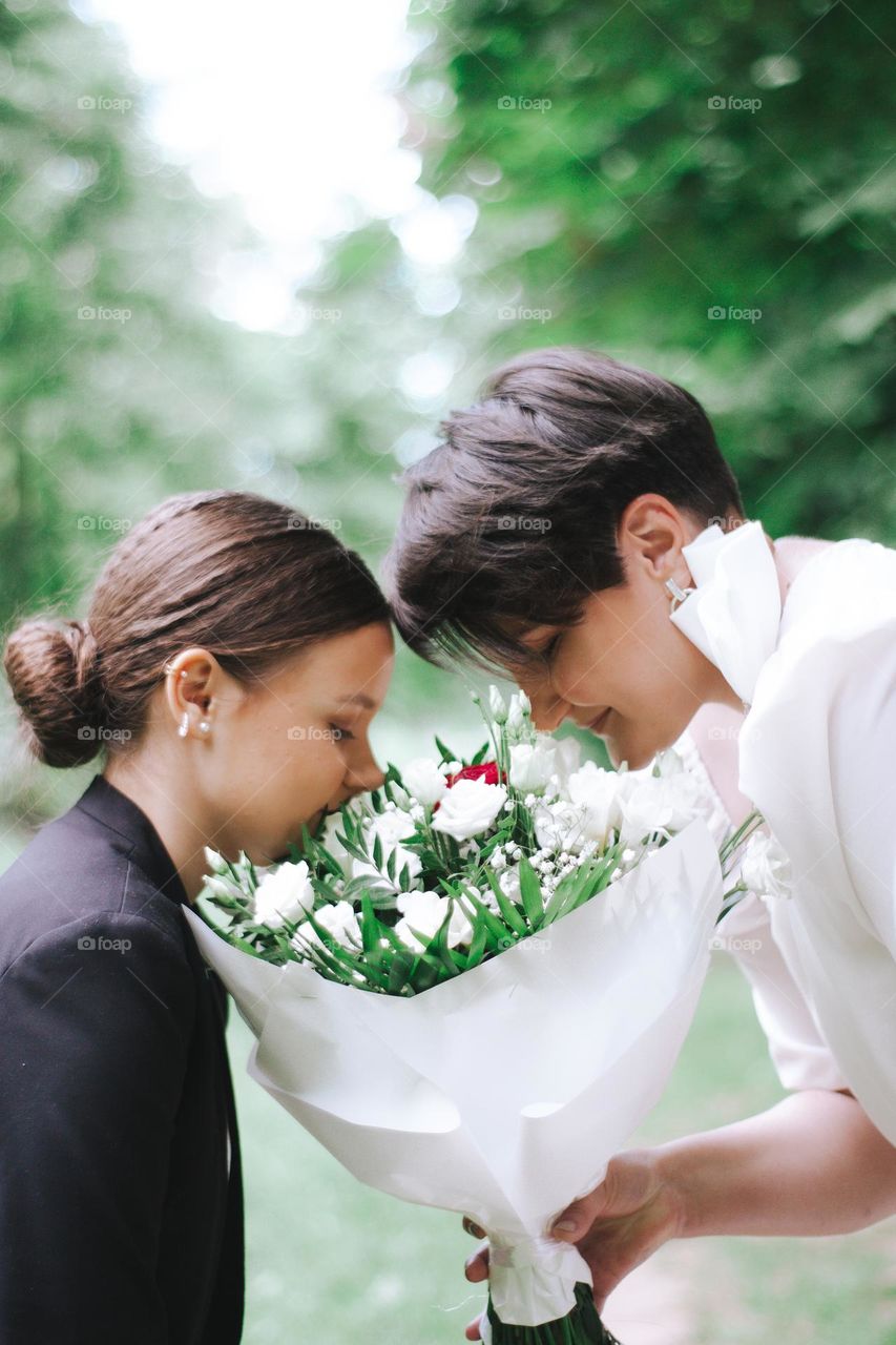 smelling the beautiful bride bouchet