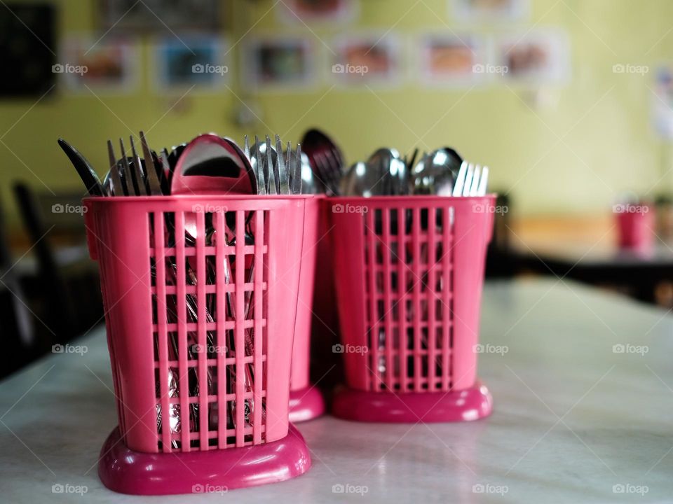 Stainless steel cutleries in pink container