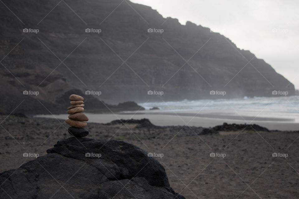 Playing with stones at beach