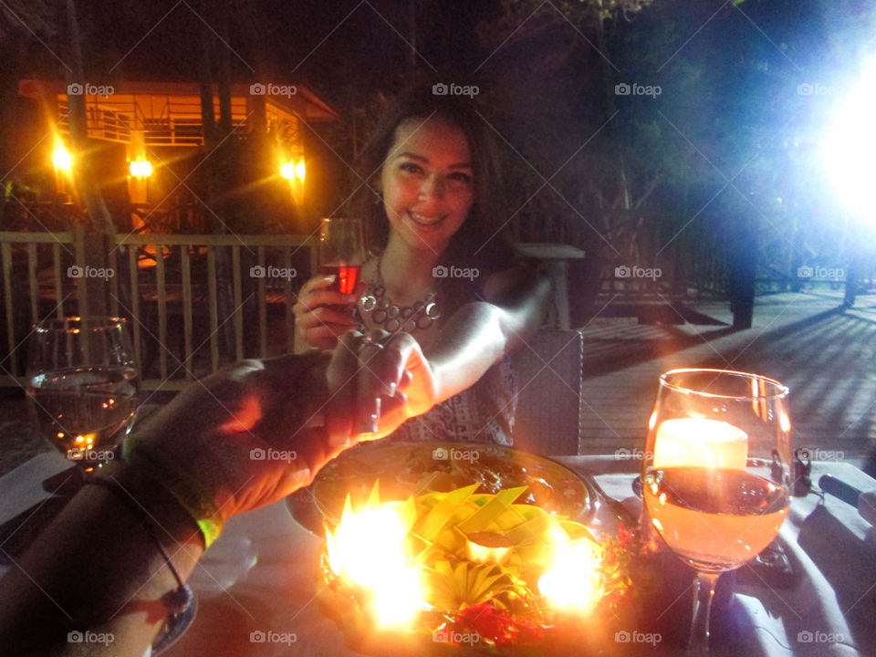 Couple celebrating their engagement ceremony with wine