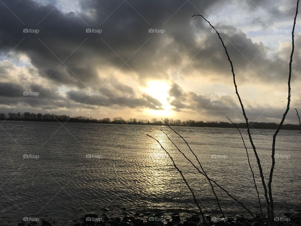 along the river sunny and stormy day 