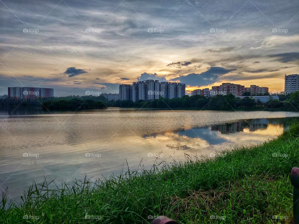 Evening at a lake with appartment view