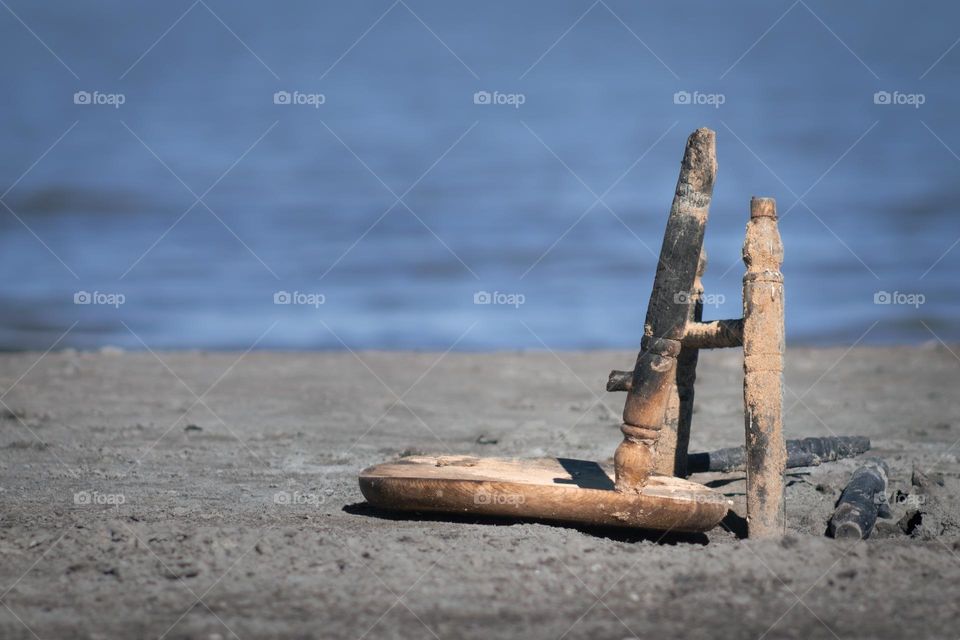 Broken stole on the beach