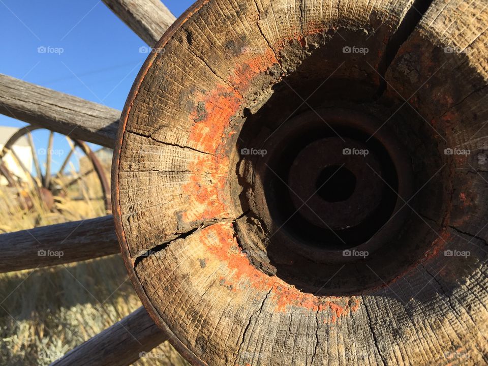 Wagon wheel hub closeup. Closeup shot of an antique wagon wheel hub with original red paint