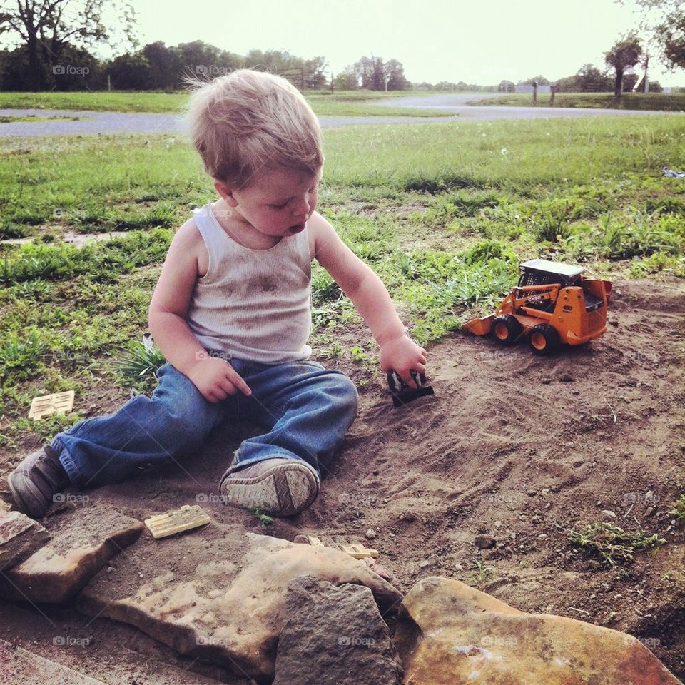 Boy playing in dirt