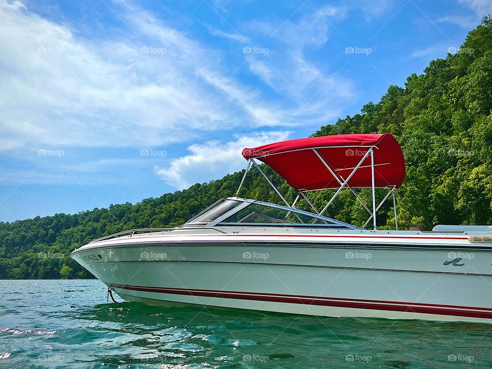 Beautiful, red & white boat on Lake Cumberland in Kentucky 