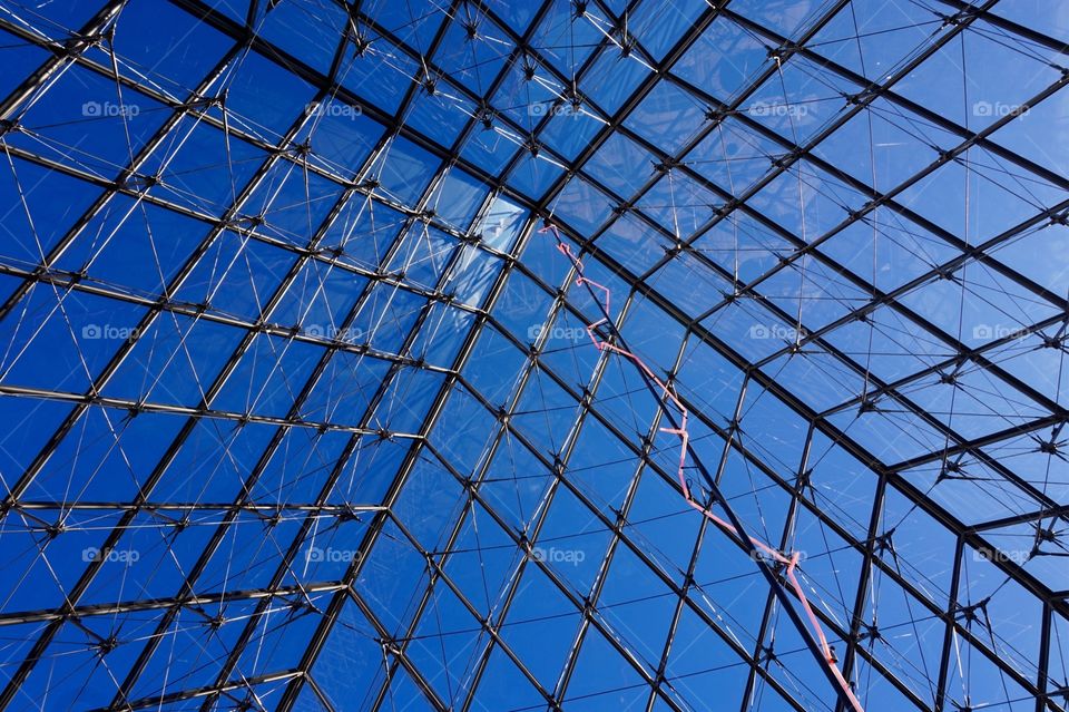 Inside the glass pyramid at the Louvre, Paris 