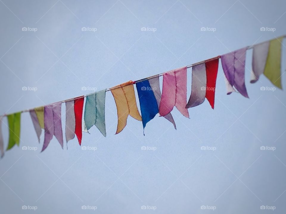 Colorful flags on a ship in the Halong Bay