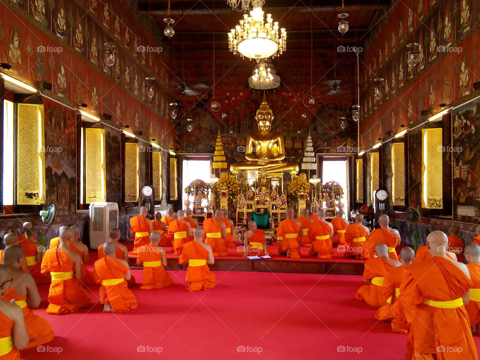 buddhist monks. buddhist monks pray in temple