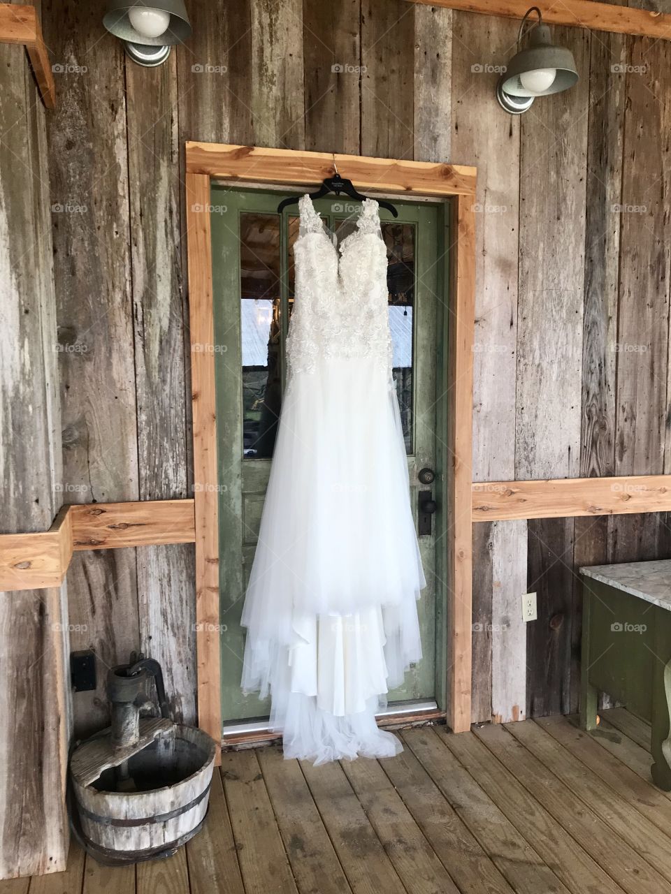 Wedding dress hanging on door