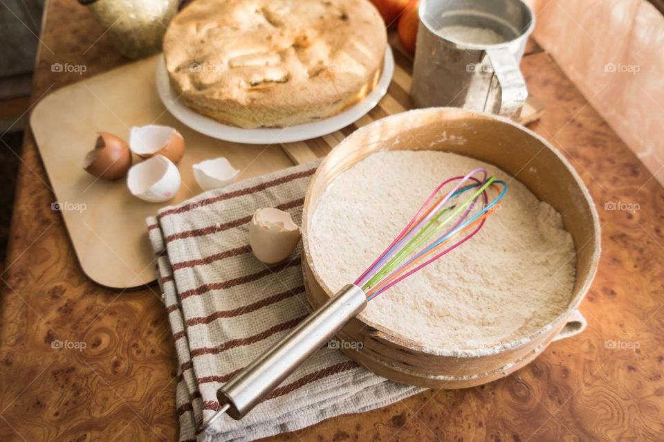 Making homemade puffed apple pie with eggs, sugar and flour.