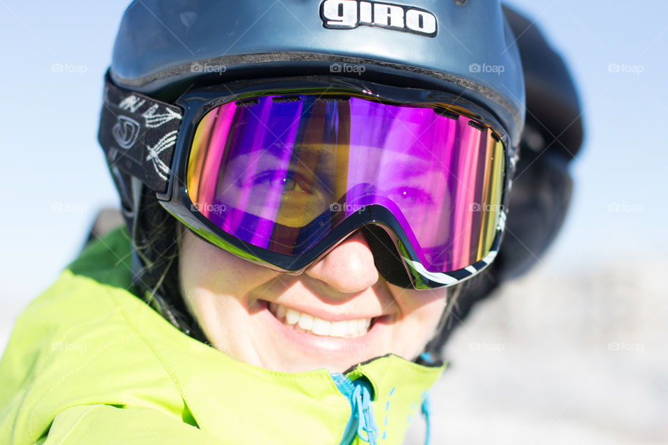 Nicole checking out the slopes from the chairlift with a big grin 