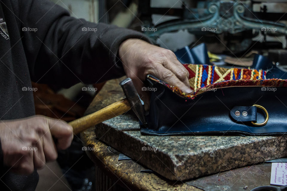 This man is creating handmade purses with very good leather and amazing colors. I am posting the stages of cutting and finishing those purses using different tools.
