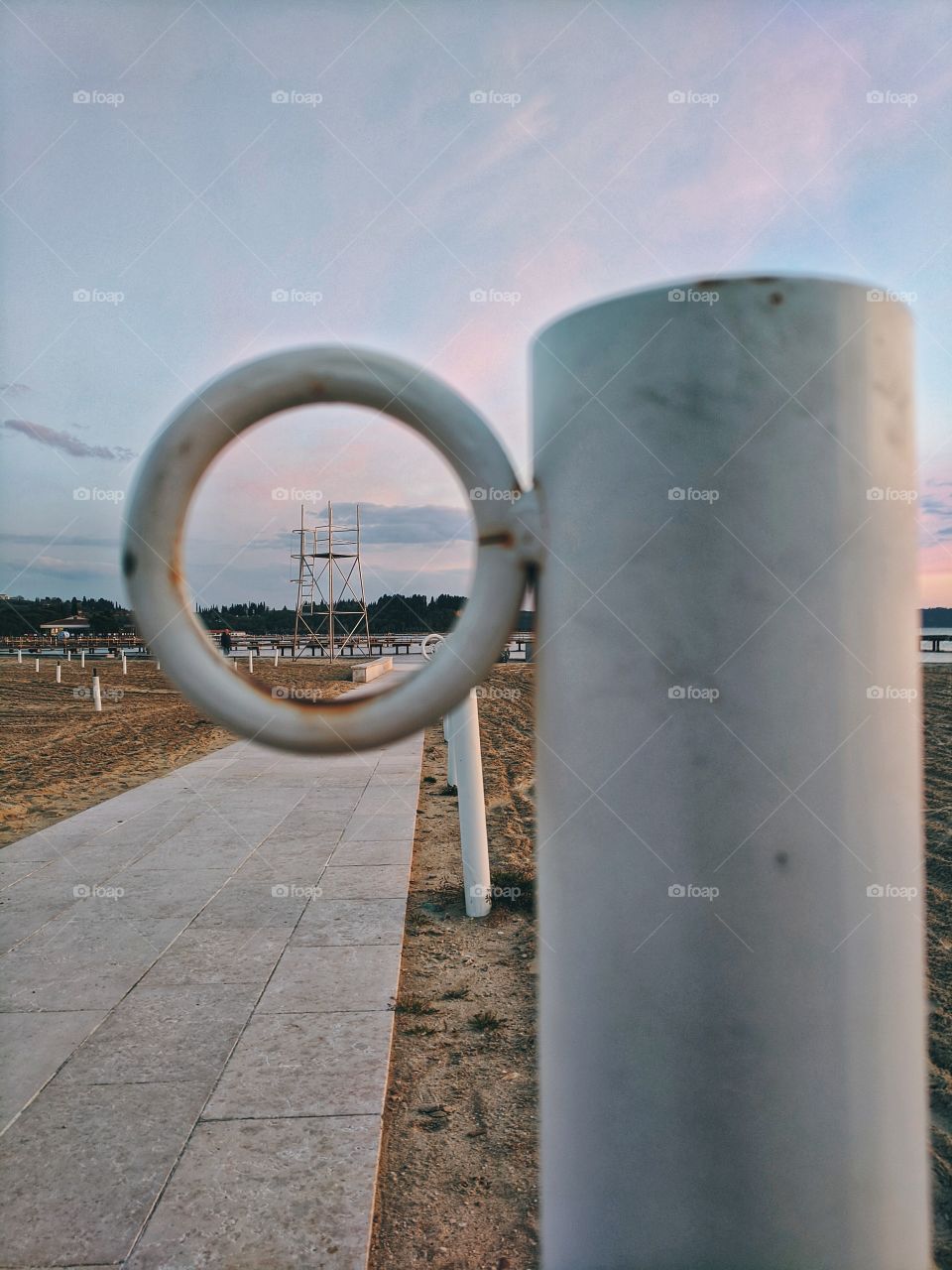 View of the lifeguard tower through the ring on the beach in the evening on the Adriatic coast.