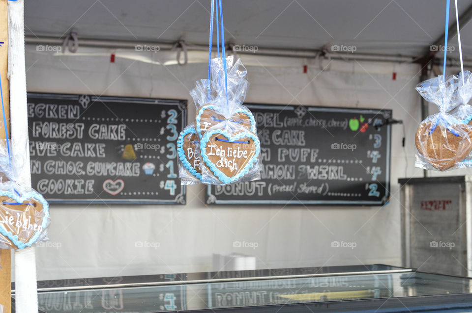 German cookies hanging from a pastry vendor stand at a festival