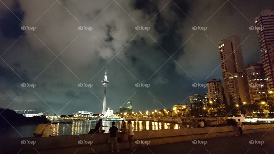 a night time photo  in the seaside of Nam Van Lake Show.  in this lake held the international dragon boat compitation in Macau.  accross that lake is the Macau tower,  the highest bungy in the world..