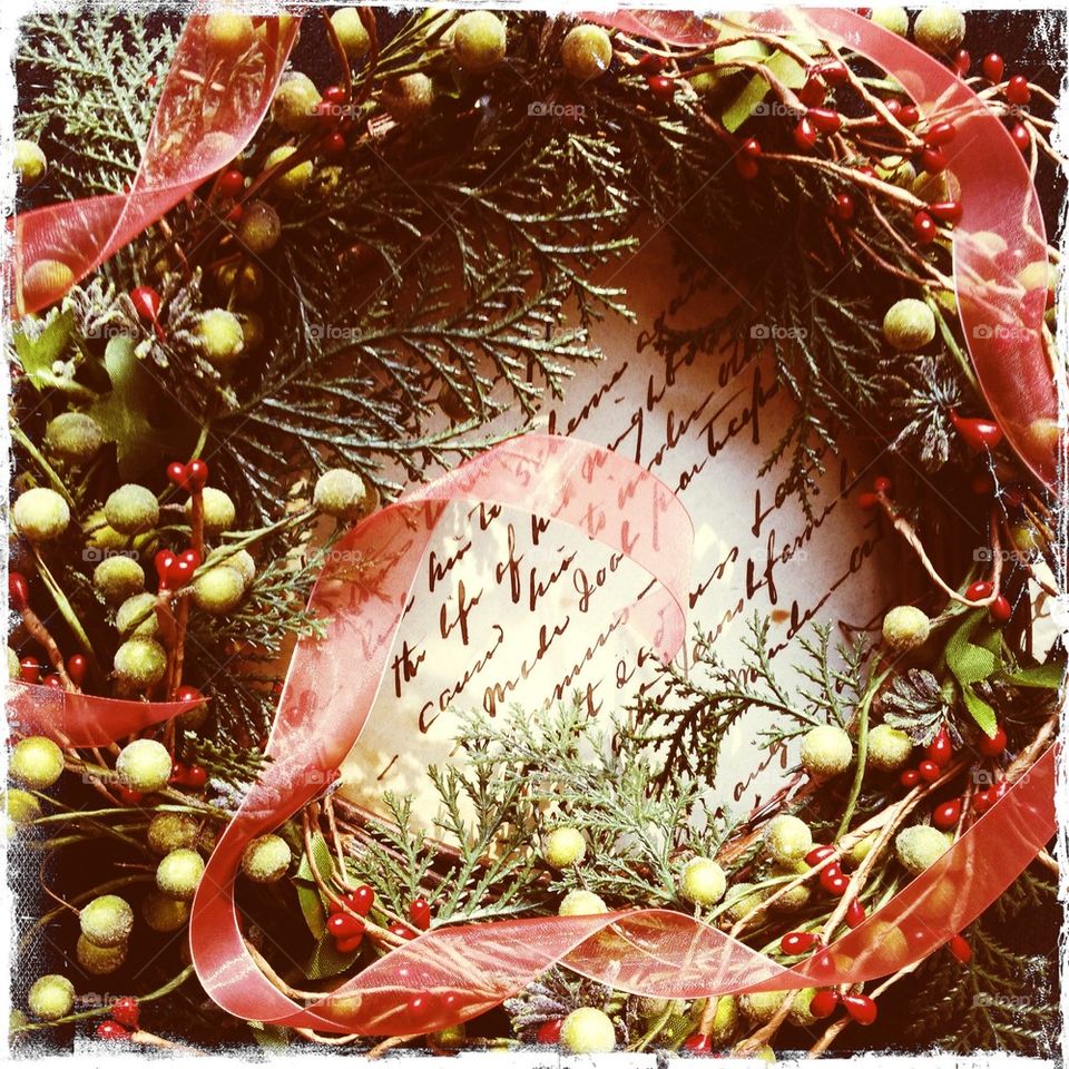 Christmas wreath on old handwriting