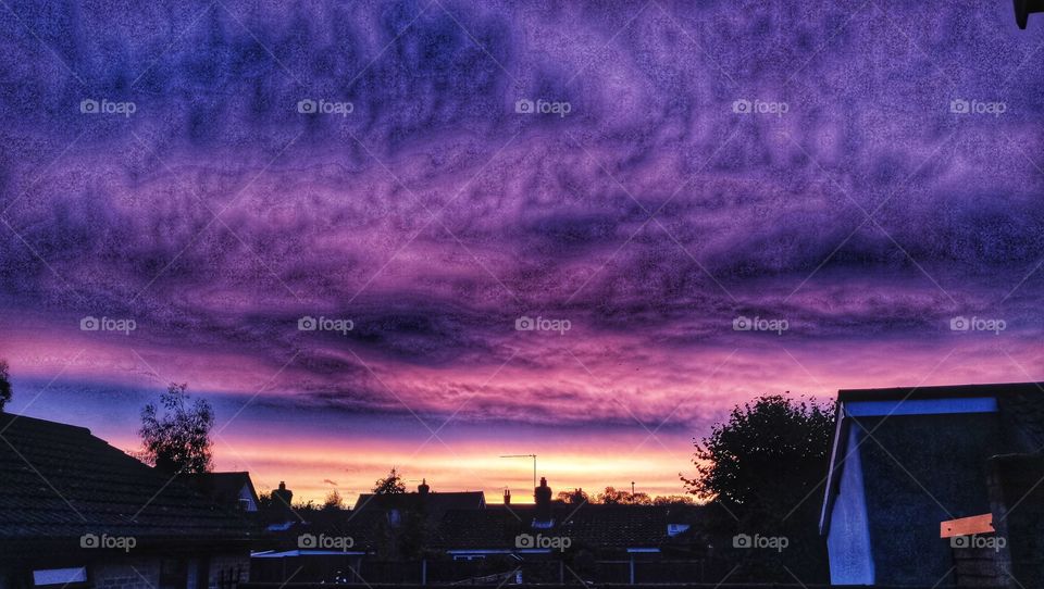 Amazing sunrise with purple and orange colours in the sky.