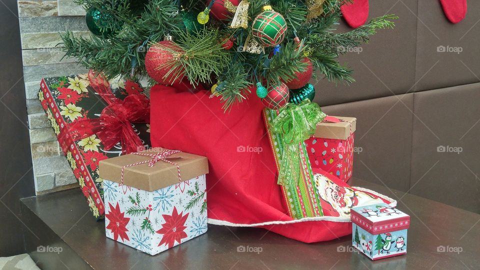 Christmas tree with red skirt and gifts