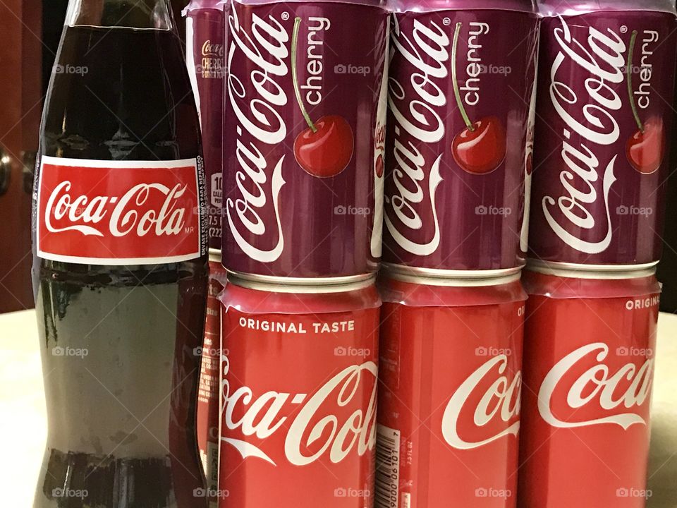 Coca Cola and cherry coke cans and bottle 