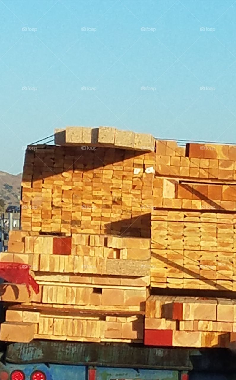 a load of lumber stacked just so