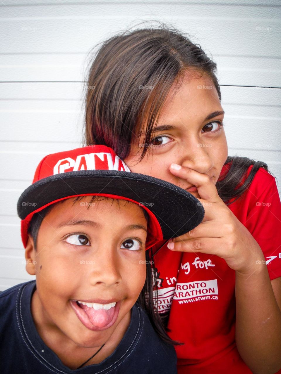 Portrait of siblings fooling around