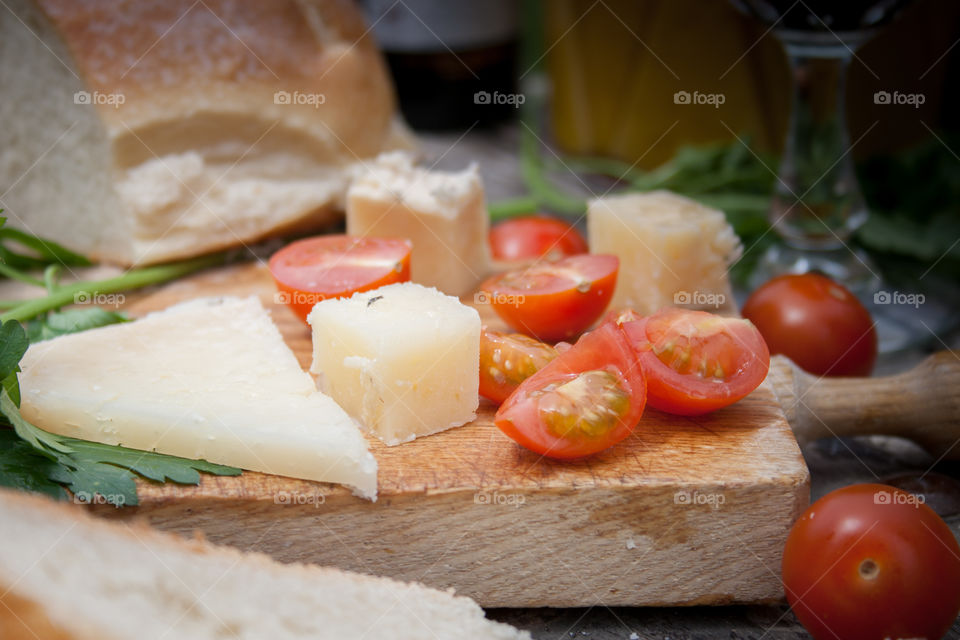 Pieces of cheese and cherry tomatoes