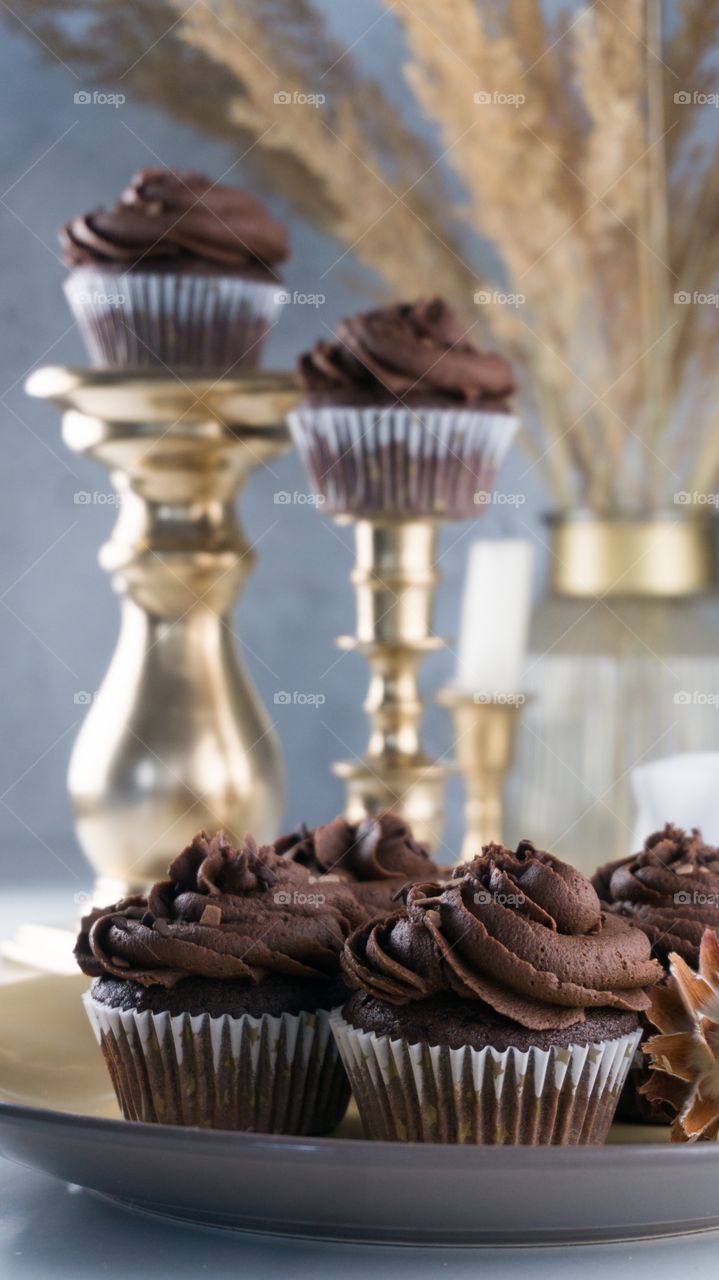 chocolate muffins on a white table