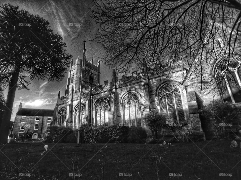 Church - Anglican Church of England traditional village parish church in the English Midlands Warwickshire England uk - edited in high contrast black and white 