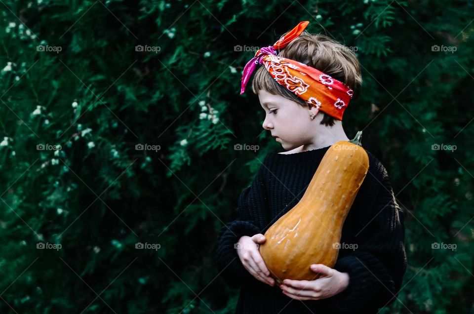 Girl with a pumpkin.