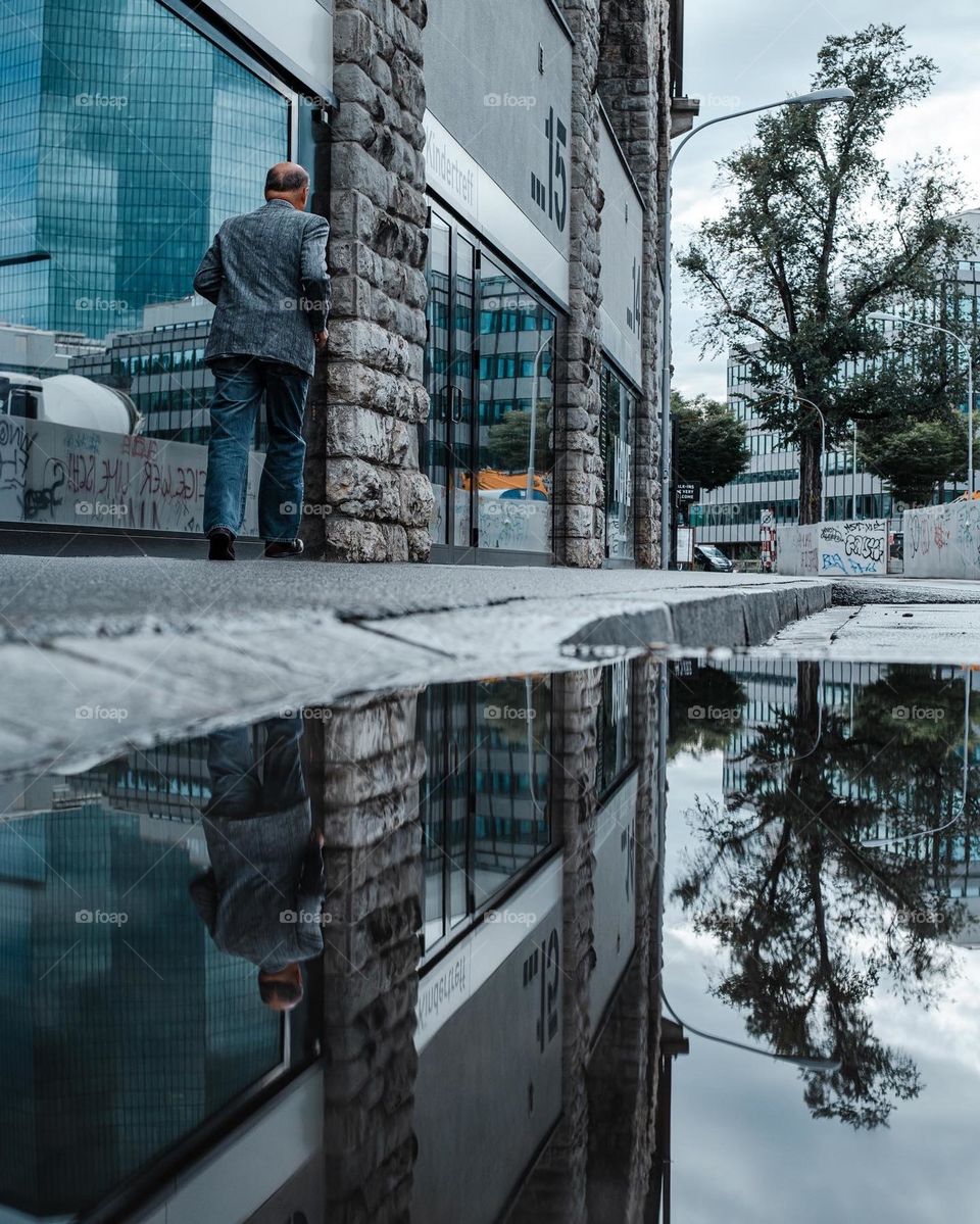Street Photography with a Pond with reflection