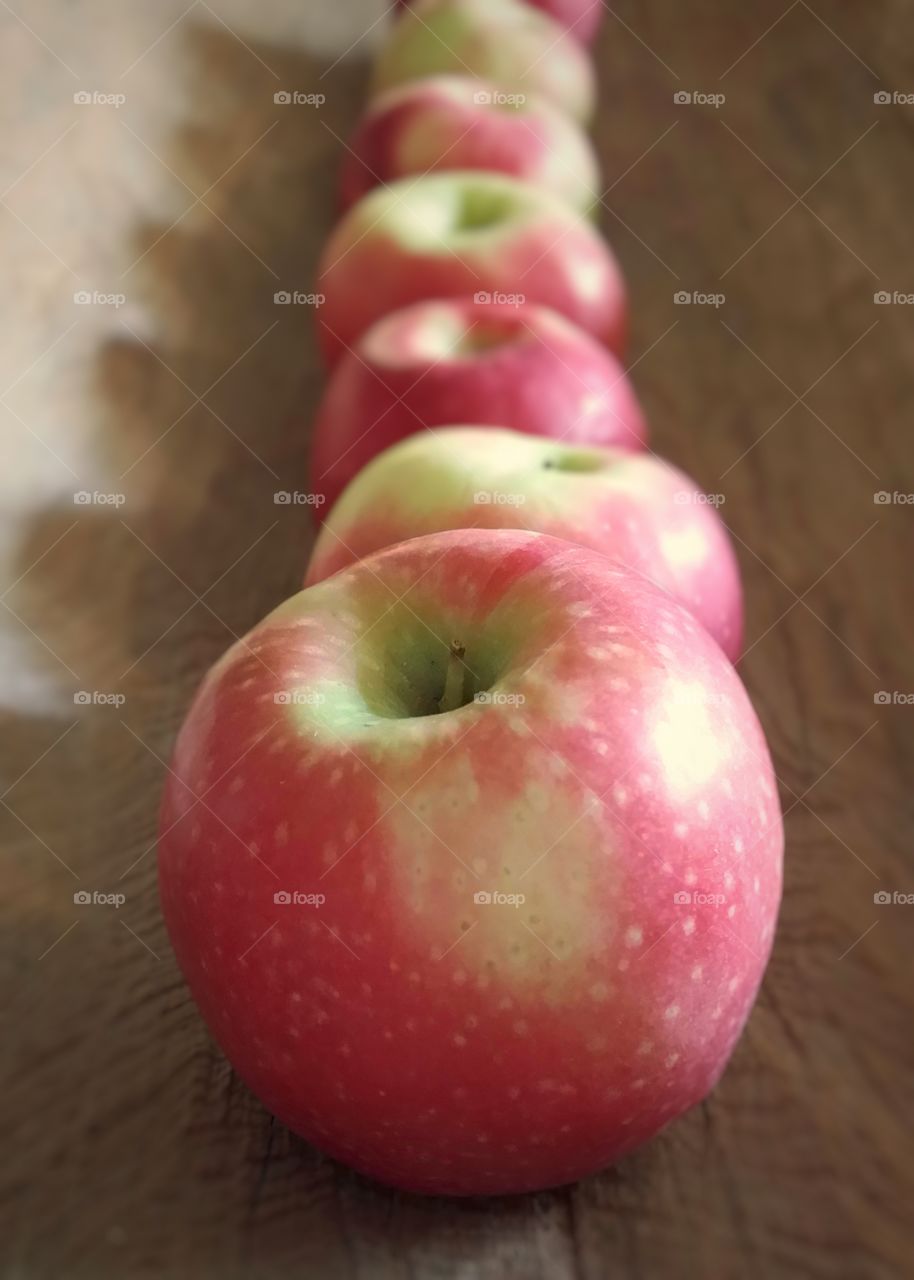 Organic apples in a row