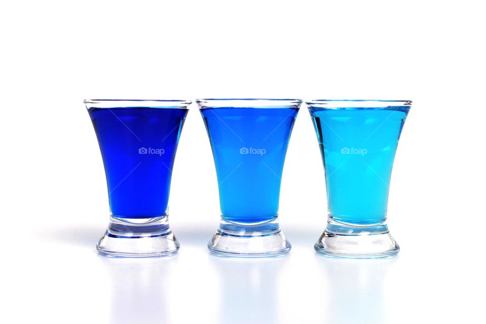 Three blue shots on white background 