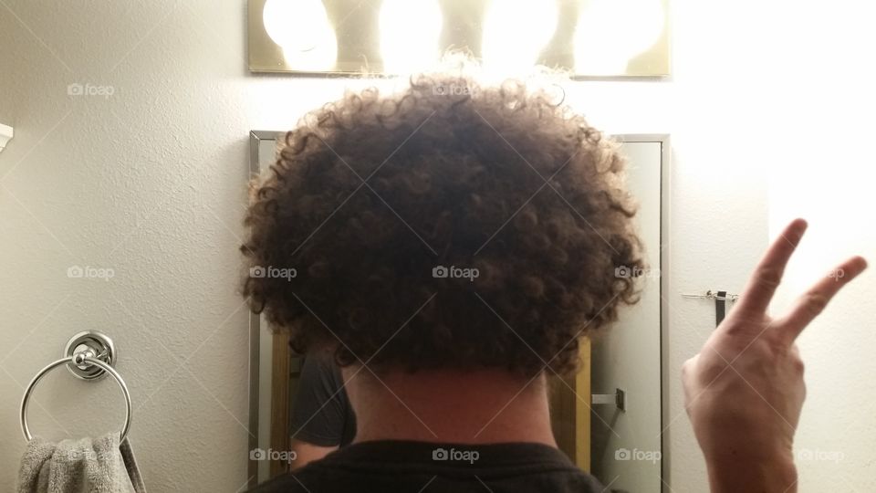 afro in bathroom mirror