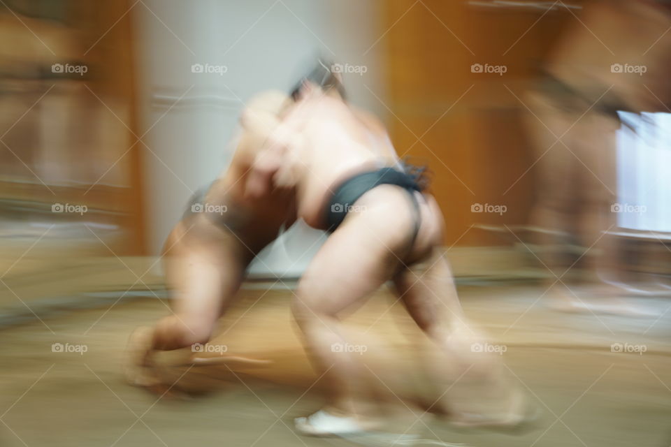 Japanese Sumo wrestlers trading at a stable