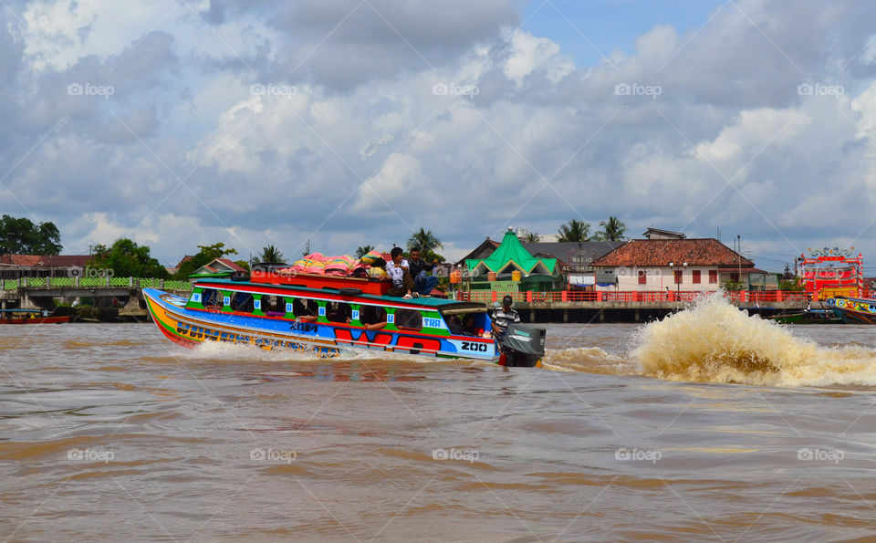 Fast Traditional Boat crossing the Musi River Palembang South Sumatera Indonesia