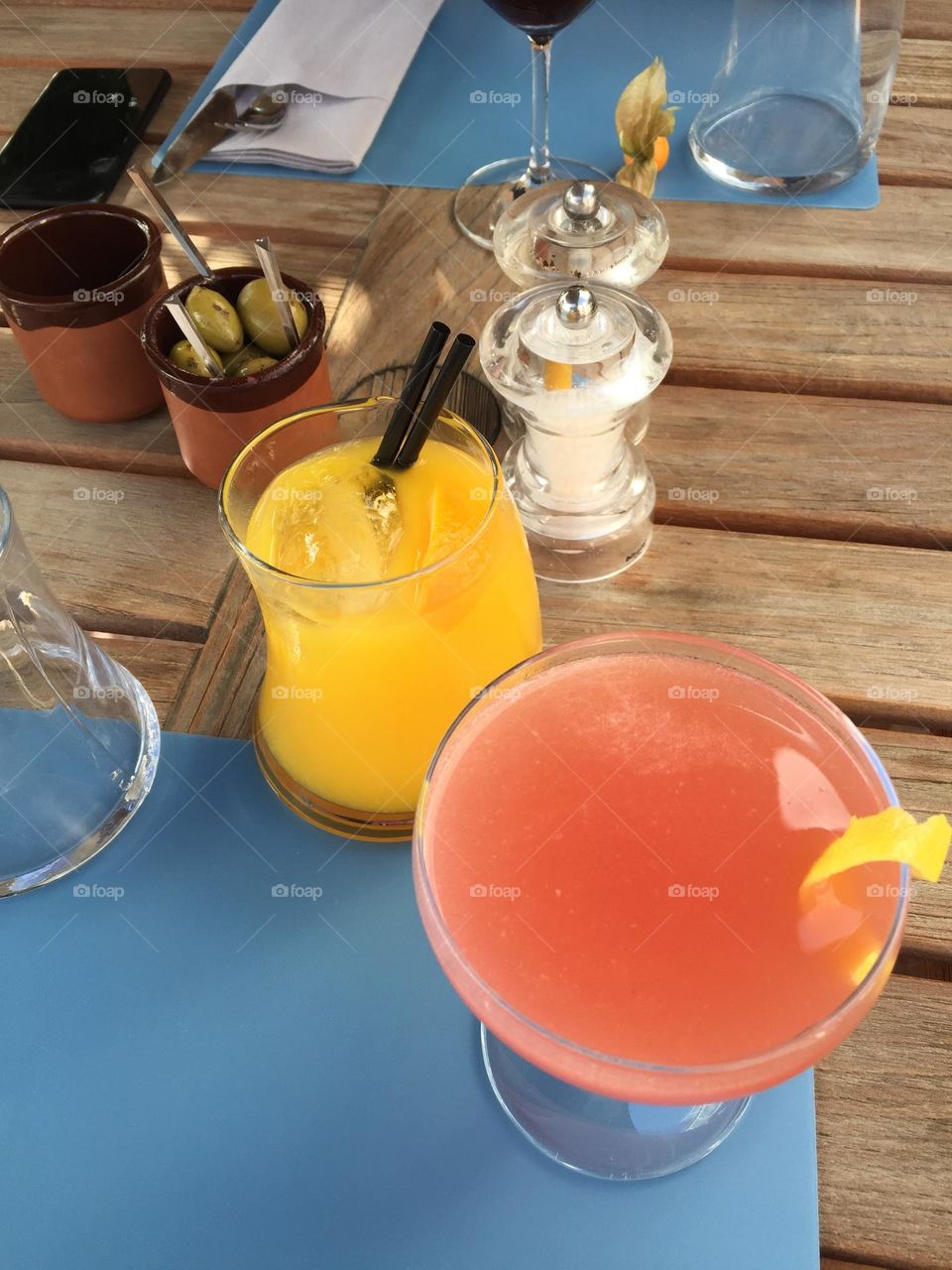 Colorful drinks on wooden table 